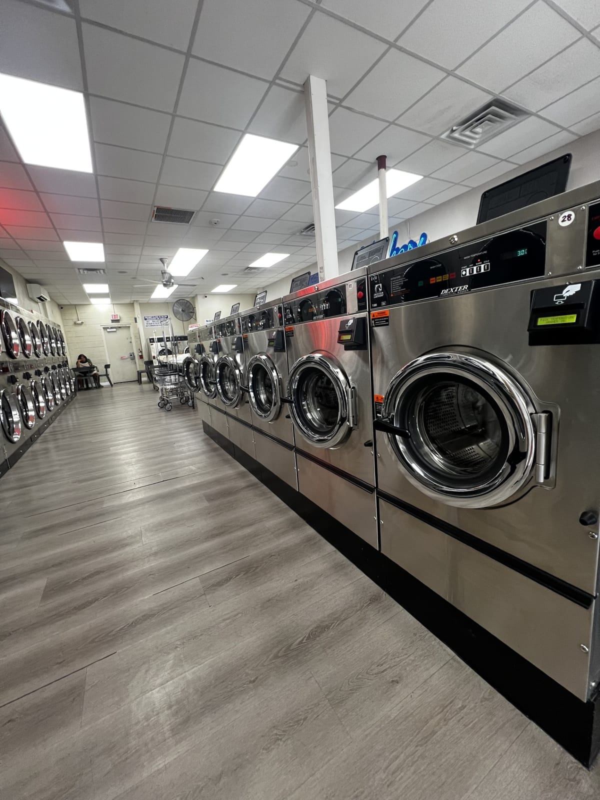 Row of Dexter commercial washers at Suds Laundromat in Surprise, Arizona